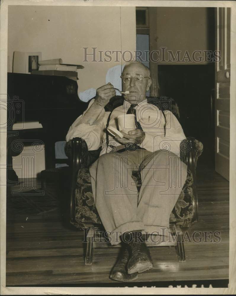 Load image into Gallery viewer, 1953 Press Photo Dr. Philip Jeansonne, Doctor eats vanilla ice cream
