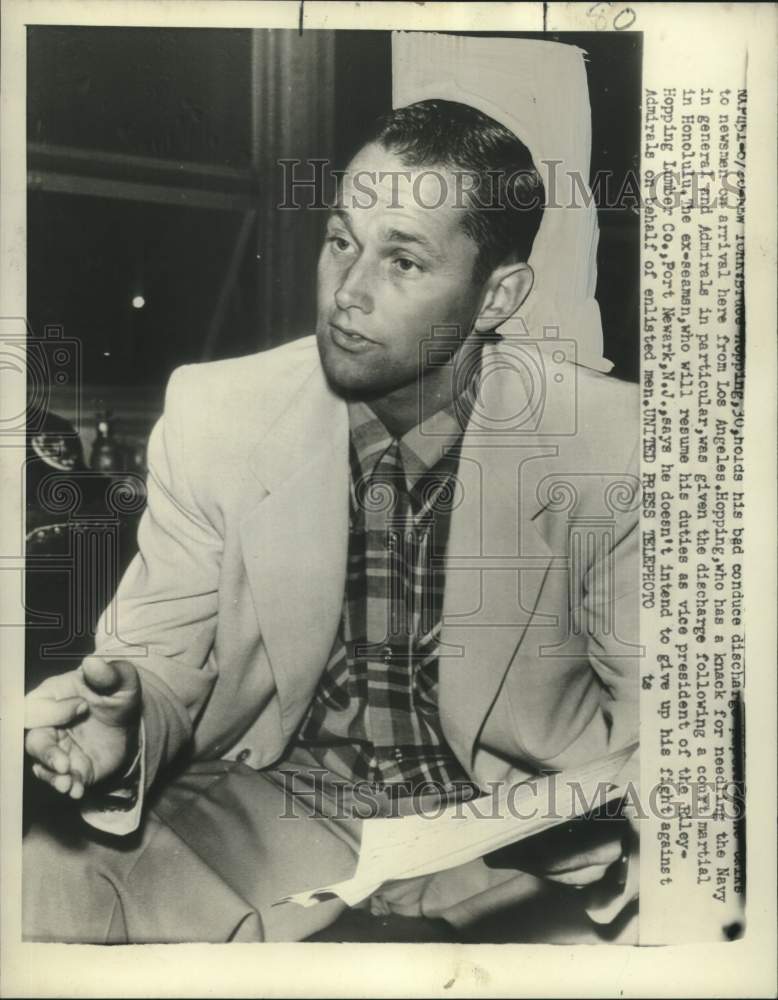 1952 Press Photo Bruce Hopping, 30, holds his bad conduct discharge papers