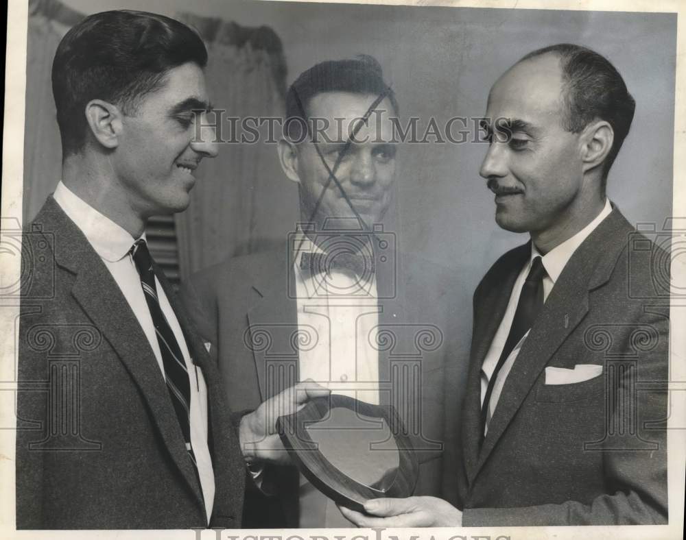 1957 Press Photo Kenneth Jumonville receives a plaque at an event - nox28602