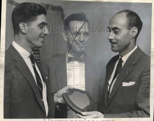 1957 Press Photo Kenneth Jumonville receives a plaque at an event - nox28602