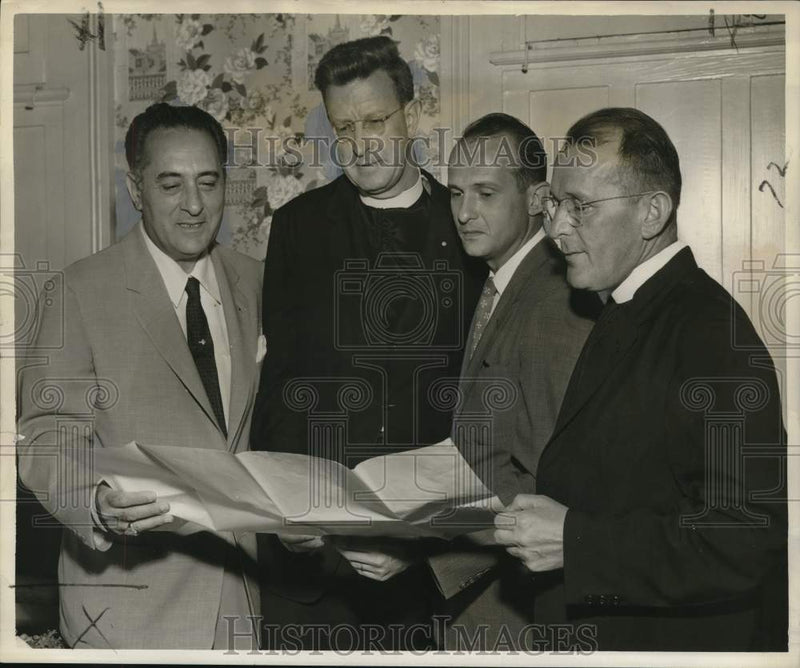 Load image into Gallery viewer, 1957 Press Photo Holy Name Society members study plans for an upcoming rally
