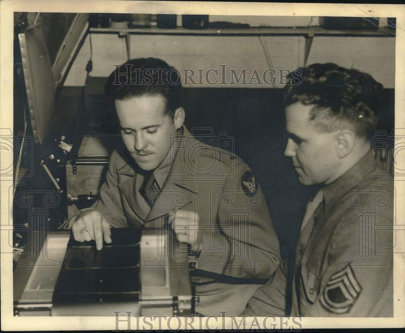 Load image into Gallery viewer, 1944 Press Photo Servicemen Examine Bomb Strike Photos at B-24 Liberator Station

