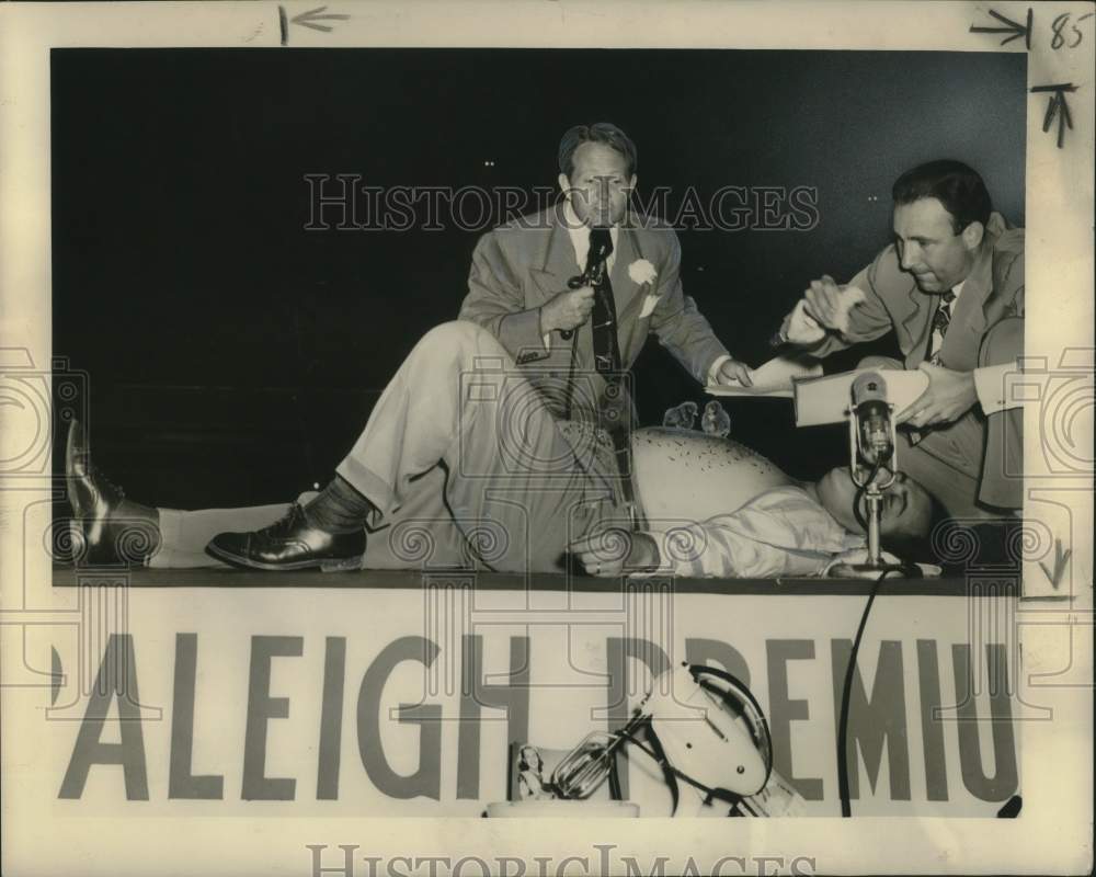 1949 Press Photo Julian Codian poses as a log in the woods on &quot;People Are Funny&quot;