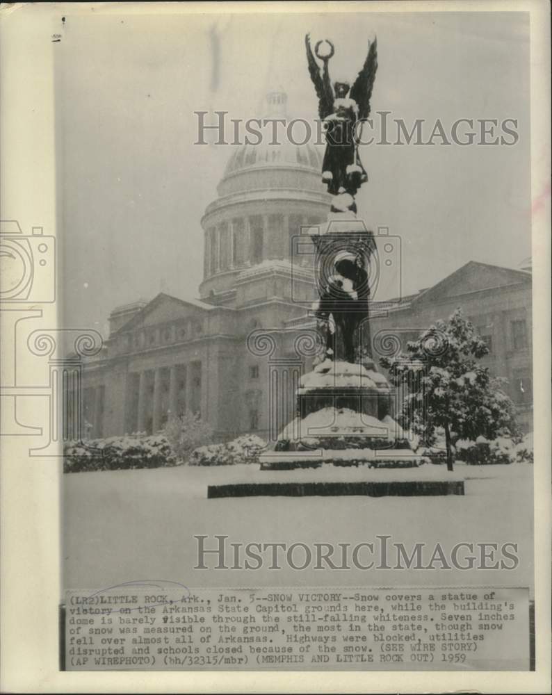 1959 Press Photo A statue at the Arkansas State Capitol covered in snow