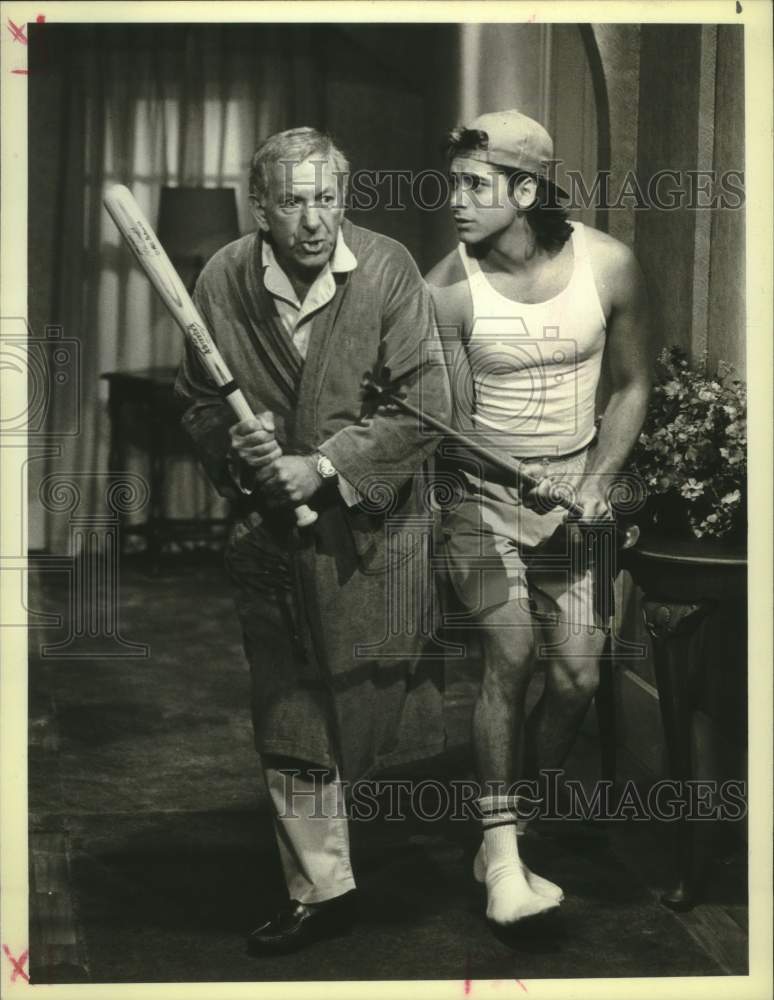 Load image into Gallery viewer, 1986 Press Photo Jack Klugman &amp; John Stamos combat burglars in 'You Again?"
