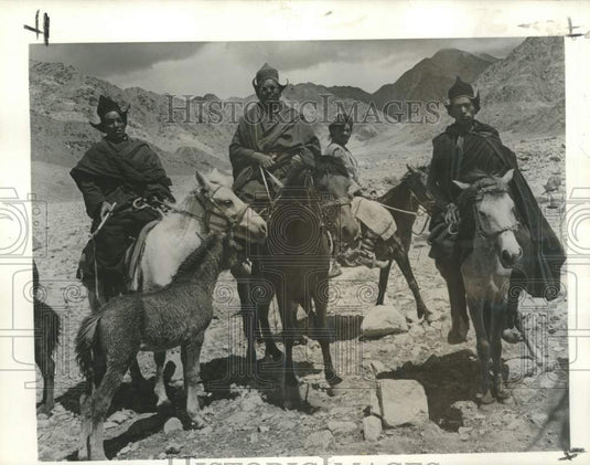 1962 Press Photo Monks travel by horseback across the inhospitable land.