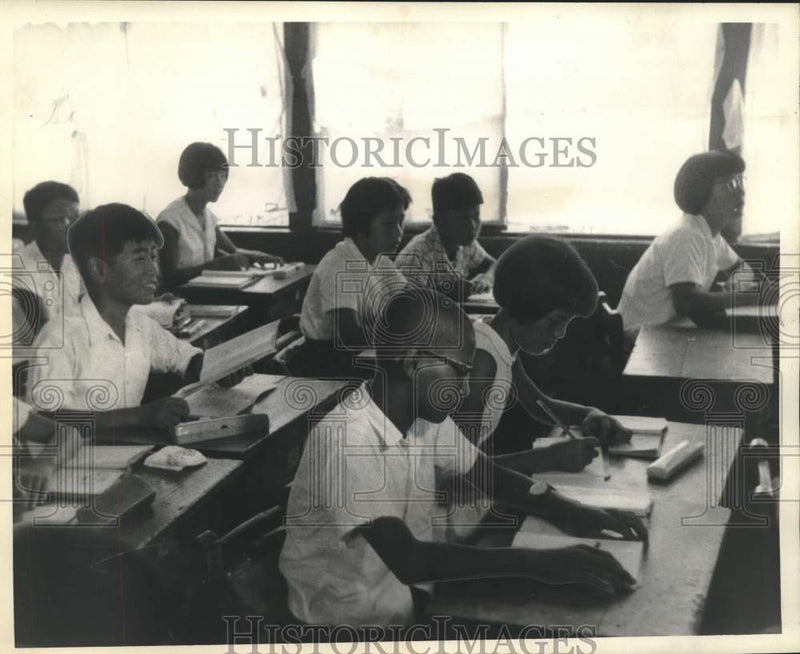 Load image into Gallery viewer, 1959 Press Photo Pupils at their desks in class at Okazaki Elementary in Tokyo
