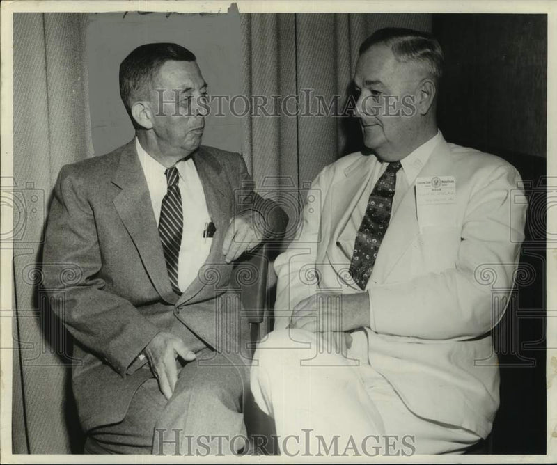 Load image into Gallery viewer, 1954 Press Photo Dr. Walter B. Martin chats with a friend - nox33719
