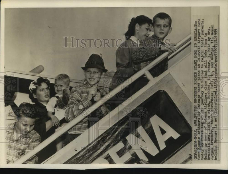 Load image into Gallery viewer, 1959 Press Photo The four Kozmin brothers board a plane back to Russia
