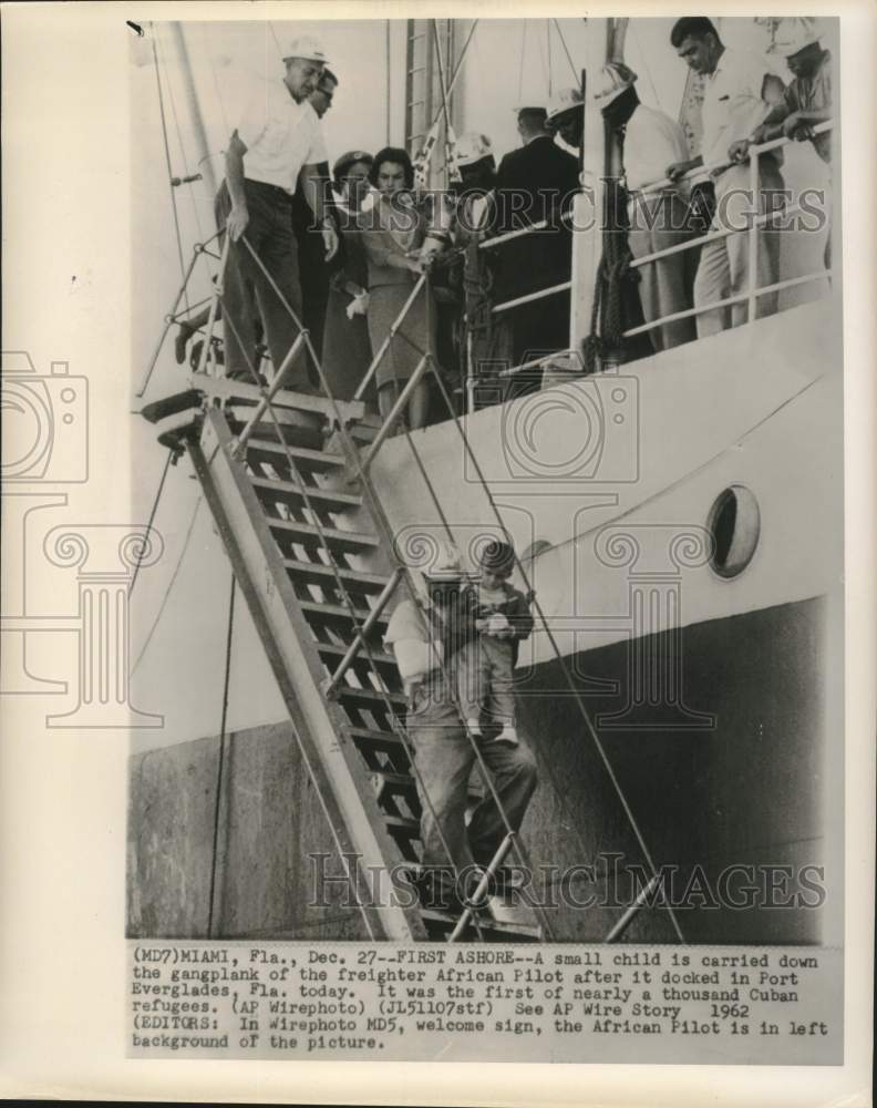 Load image into Gallery viewer, 1962 Press Photo Cuban Refugee Youngster Carried off Mercy Ship in Florida

