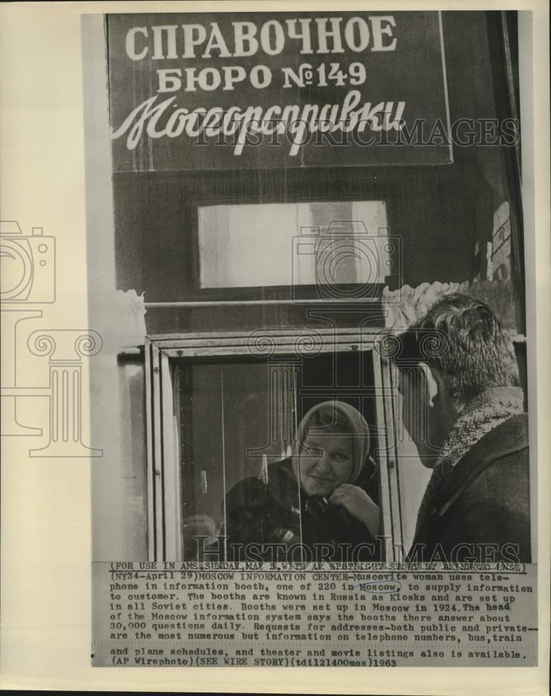 Load image into Gallery viewer, 1963 Press Photo A Muscovite woman answers questions in a information booth
