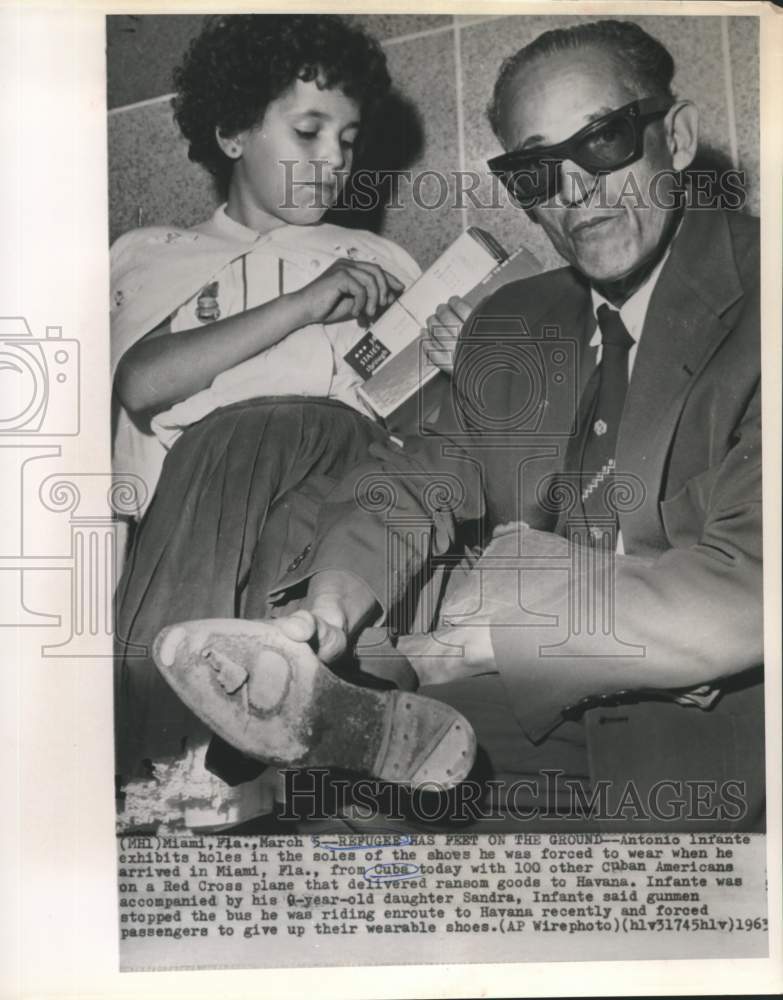 1963 Press Photo Shoes Given Cuban Refugee Antonio Infante Upon Miami Arrival