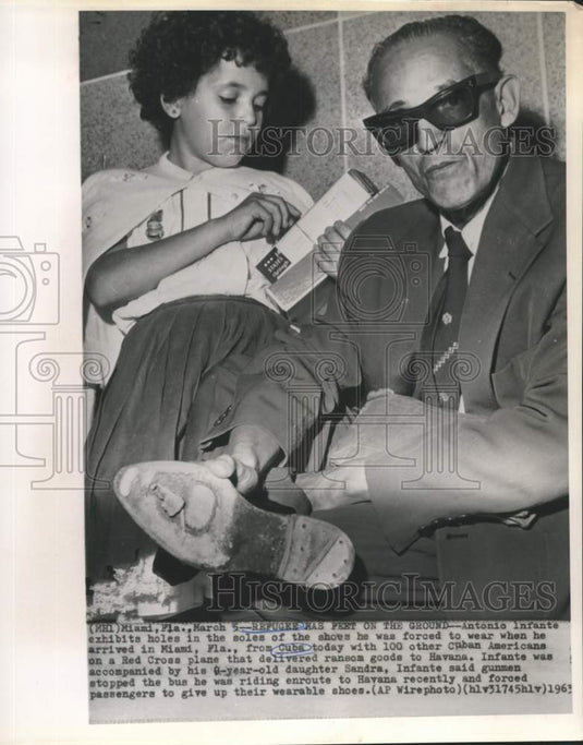 1963 Press Photo Shoes Given Cuban Refugee Antonio Infante Upon Miami Arrival