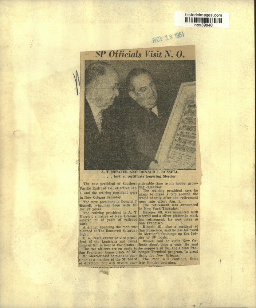 1951 Press Photo A.T. Mercier & Donald Russell look at certificate for Mercier