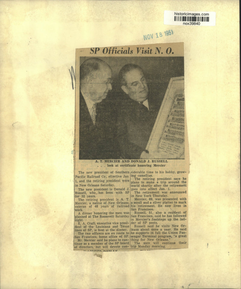 Load image into Gallery viewer, 1951 Press Photo A.T. Mercier &amp; Donald Russell look at certificate for Mercier
