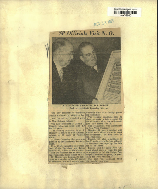 1951 Press Photo A.T. Mercier & Donald Russell look at certificate for Mercier