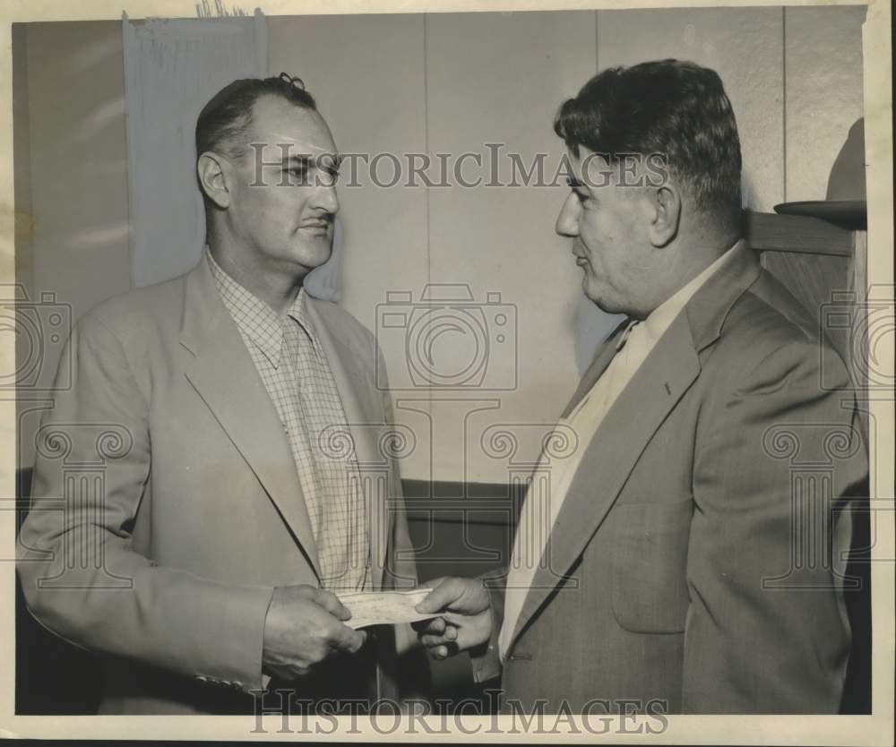 1954 Press Photo Cy Ernst & check for the Clarence J. Arceneaux Jr. Heart Fund.