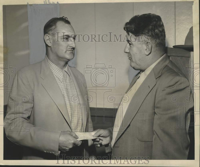 Load image into Gallery viewer, 1954 Press Photo Cy Ernst &amp; check for the Clarence J. Arceneaux Jr. Heart Fund.
