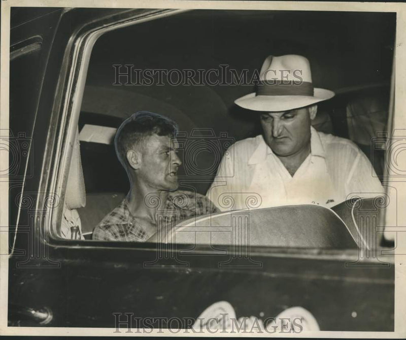 Load image into Gallery viewer, 1951 Press Photo Alvin Newman and Deputy Sheriff Nolan Orgeron in a police car.
