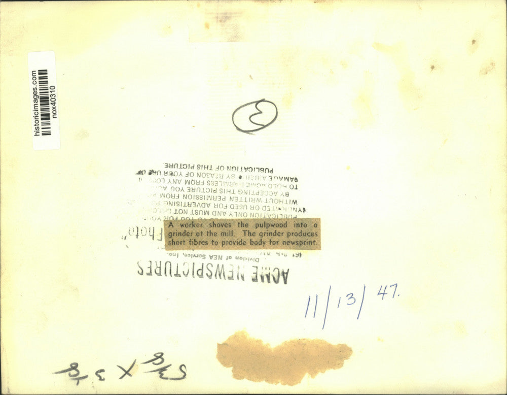 1947 Press Photo Pulpwood Fed into Grinder to Produce Short Fibers - nox40310