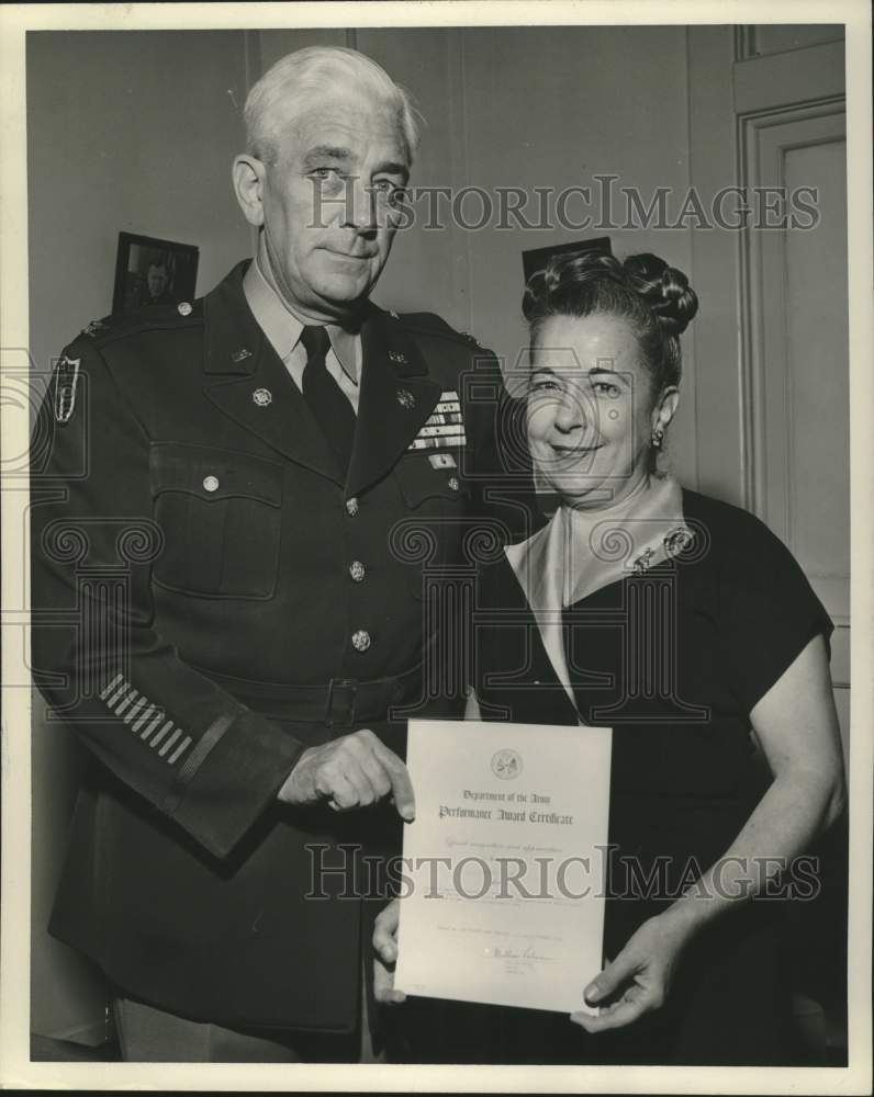 Load image into Gallery viewer, 1956 Press Photo Colonel William Palmer gives award to Mrs. Virginia Jilek.

