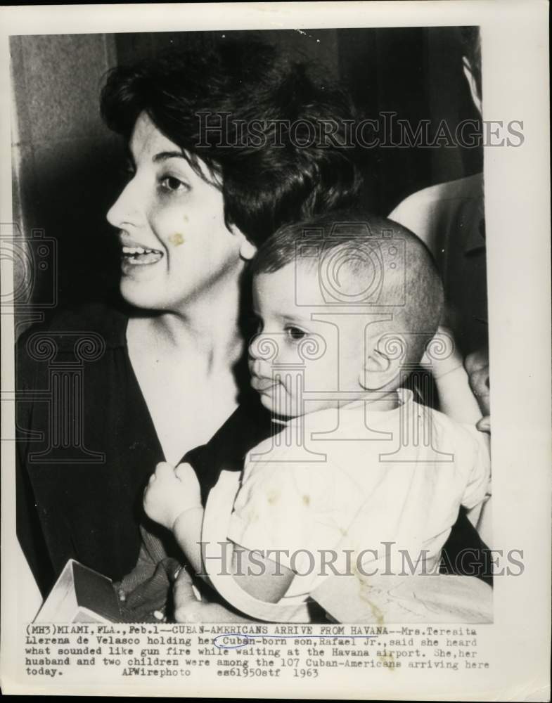 Load image into Gallery viewer, 1963 Press Photo Mrs. Tereaita Llerena de Velasco holds Jafael Jr., at airport.
