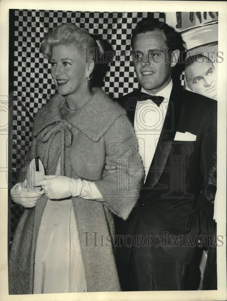 1958 Press Photo Paul Schneider escorts actress Ginger Rogers into a theatre, NY- Historic Images