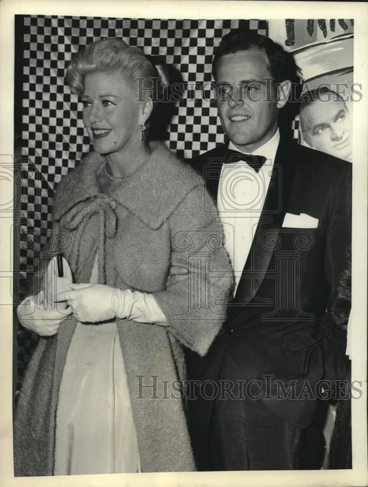 1958 Press Photo Paul Schneider escorts actress Ginger Rogers into a theatre, NY- Historic Images