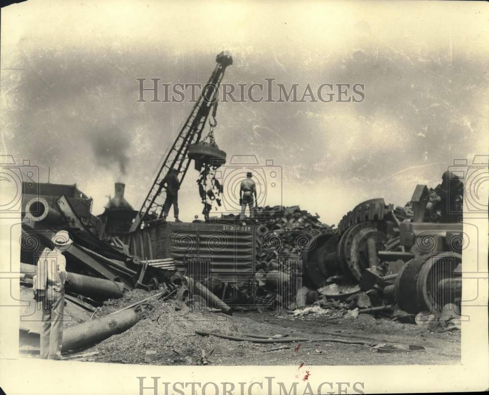 1937 Press Photo Scrap Metal Unloaded in New Orleans Junkyard - nox48761- Historic Images