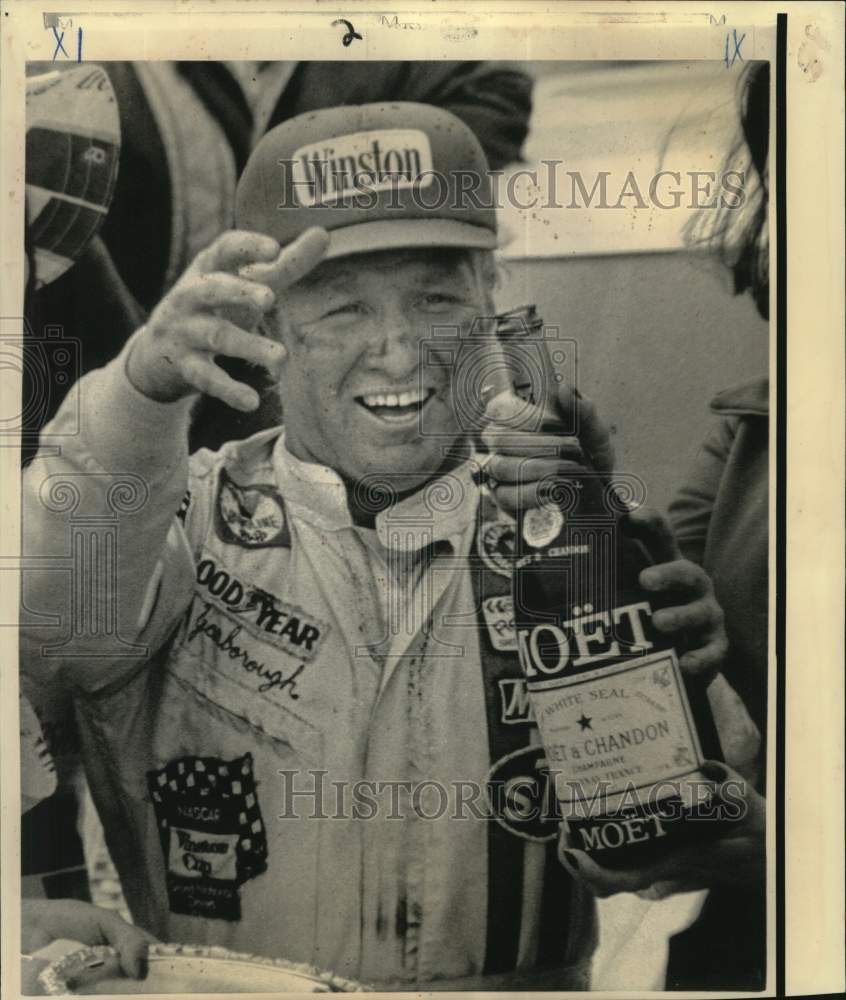 1974 Press Photo Car Racer Grabs Champagne after Atlanta 500 Win - nox51132- Historic Images