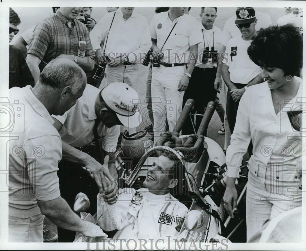 1968 Press Photo Race car driver Bobby Unser shakes hands with fans. - nox55913- Historic Images