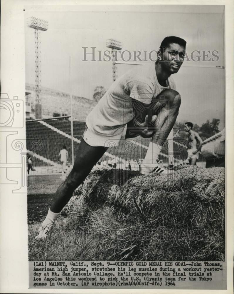 1964 Press Photo John Thomas stretches during workout at Mt. San Antonio College- Historic Images