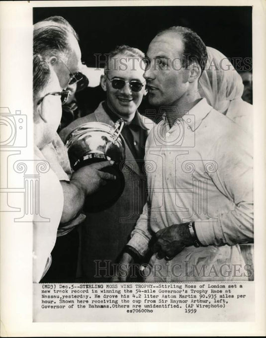 1959 Press Photo Stirling Moss presented Governor's Cup by Sir Raynor Arthur.- Historic Images