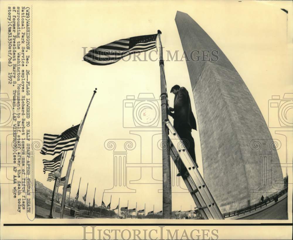 1972 Press Photo Richard Barbot lowers Washington Monument flag to half staff.- Historic Images