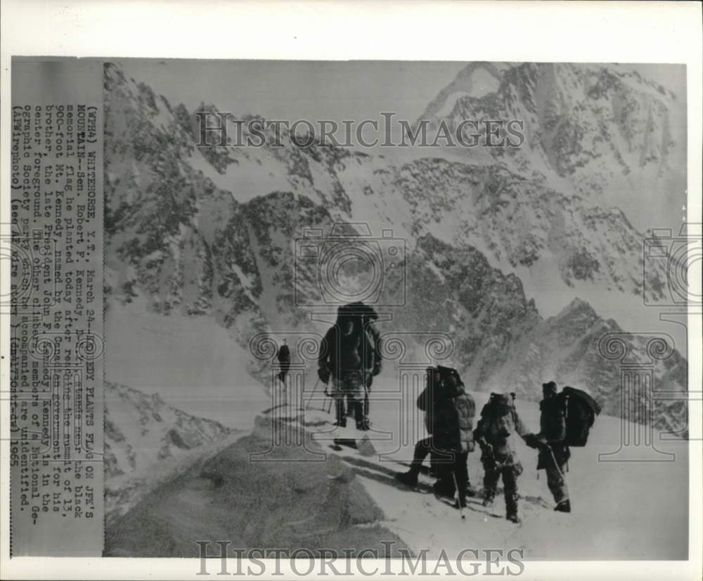 1965 Press Photo Robert Kennedy plants memorial flag at Canada&#39;s Mt. Kennedy.- Historic Images