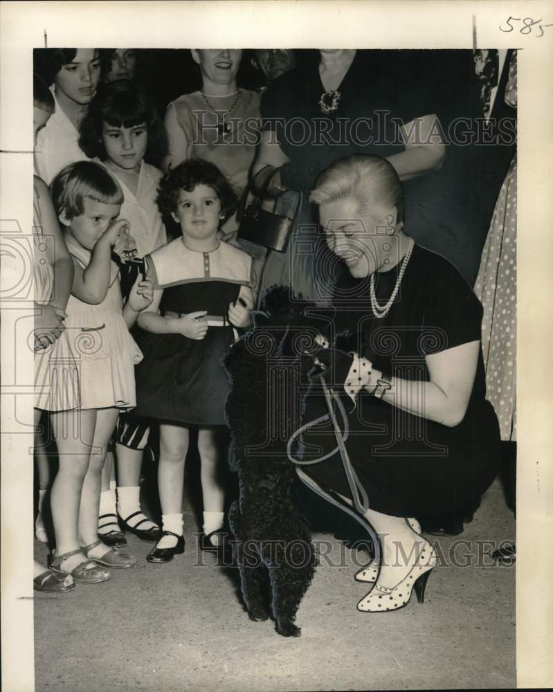 1956 Press Photo Fans of Nicole Milinaire and her poodle meet at Roosevelt Hotel- Historic Images