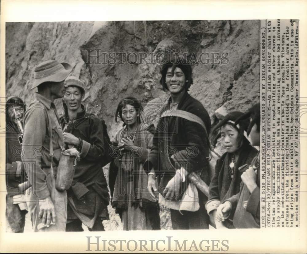 1962 Press Photo Indian Soldier with Tibetan Refugees from Communism, India- Historic Images