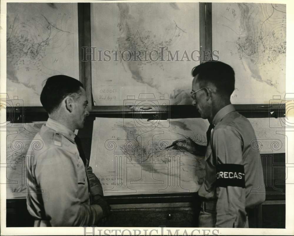 Press Photo Army pilot & official forecaster, weather charts - pim01782