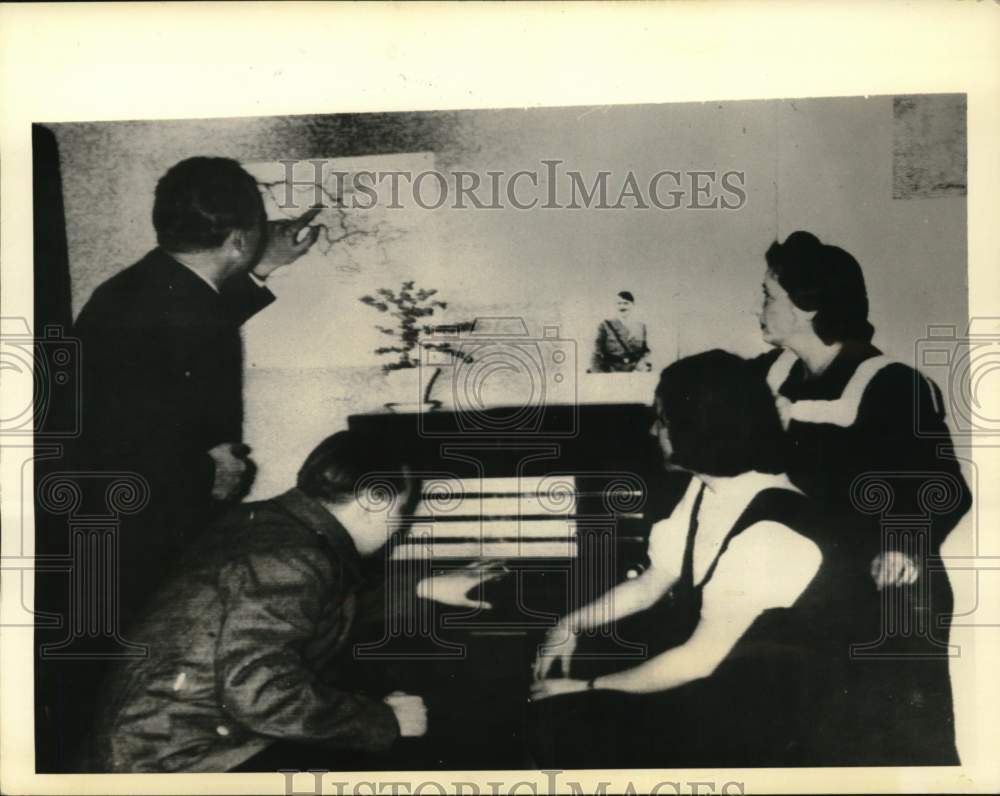 1941 Press Photo German residents listen to radio broadcast, Yugoslavian war map