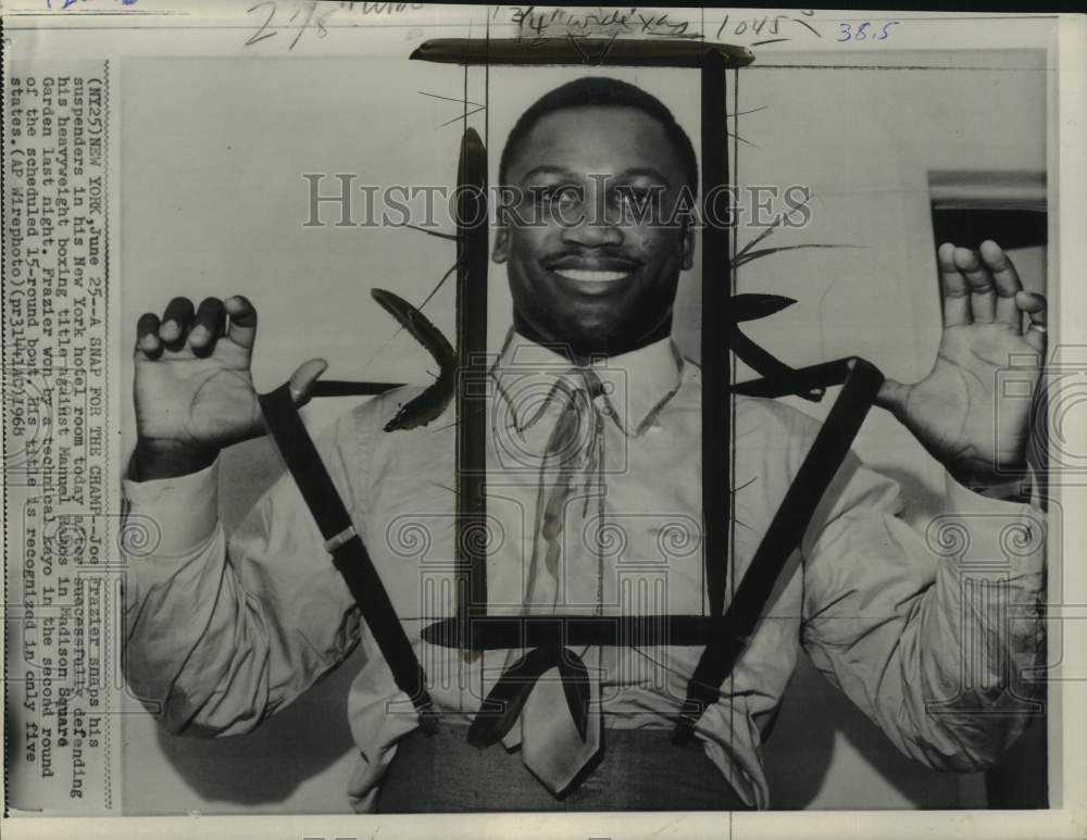 1968 Press Photo Boxer Joe Frazier snaps his suspenders after winning, New York- Historic Images