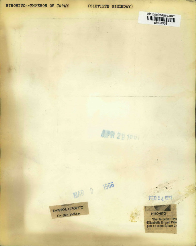 1961 Press Photo Japan's Emperor Hirohito touches blossoming cherry tree, Japan