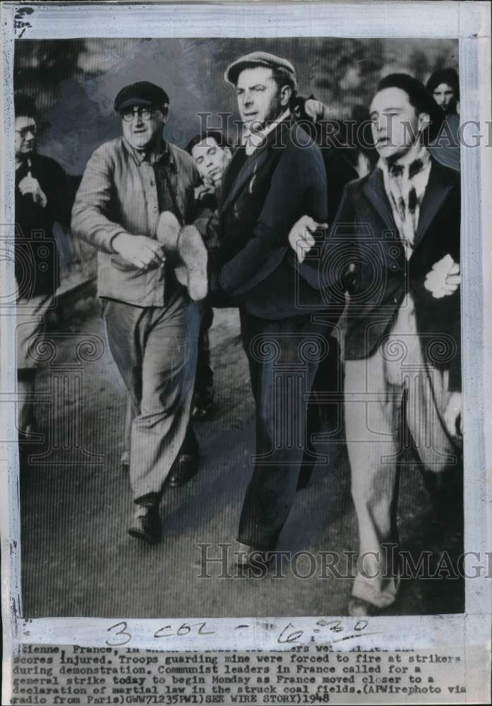 Load image into Gallery viewer, 1948 Press Photo Striking miners carry wounded coworker at St. Etienne, France
