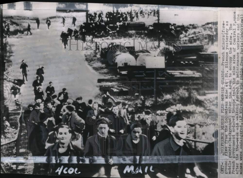 1948 Press Photo Miners flee government troops during strike in France- Historic Images