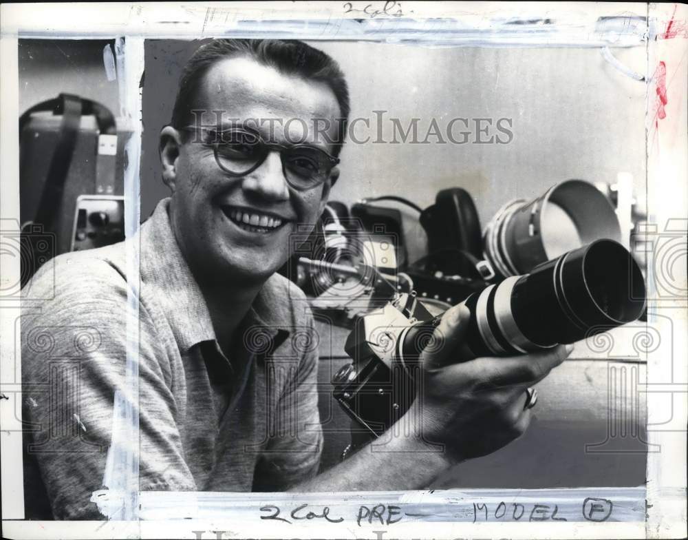 1956 Press Photo TV & radio host Bill Cullen shows lenses & camera collection