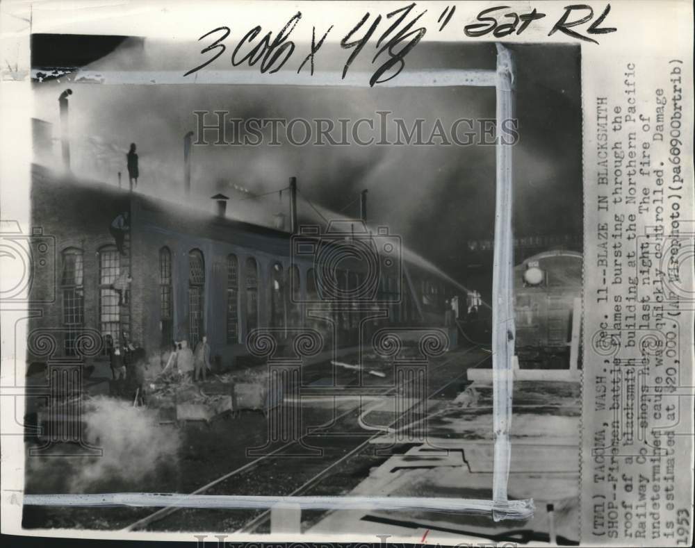1953 Press Photo Firemen putting out fire at Northern Pacific Railway Co. in WA