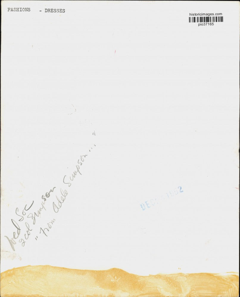 1952 Press Photo Woman models a "From Adele Simpson" dress - pio37165