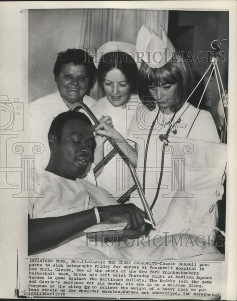 1970 Press Photo Cazzie Russell in hospital bed, signs autographs for nurses, NY- Historic Images