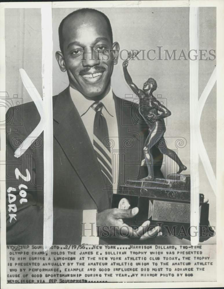 1956 Press Photo Athlete Harrison Dillard holds James E. Sullivan trophy, NY- Historic Images