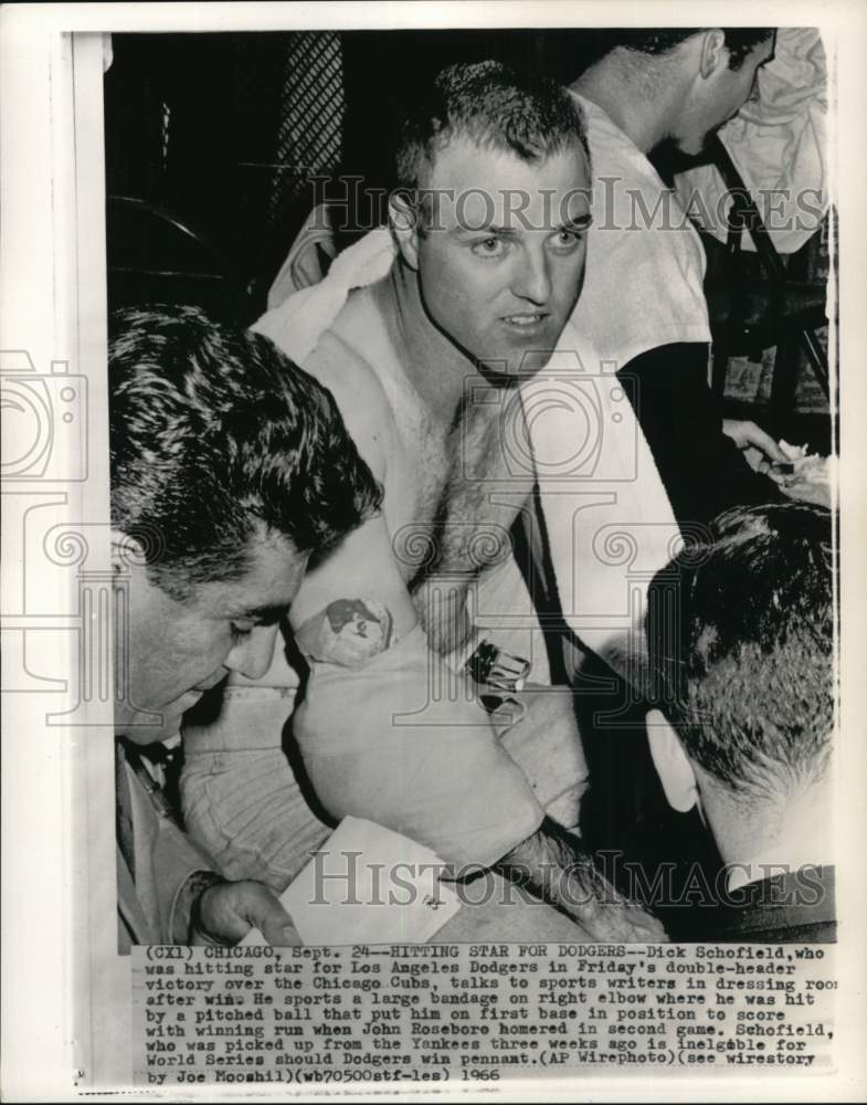 1966 Press Photo Dick Schofield with bandaged elbow talks to sports writers, IL- Historic Images