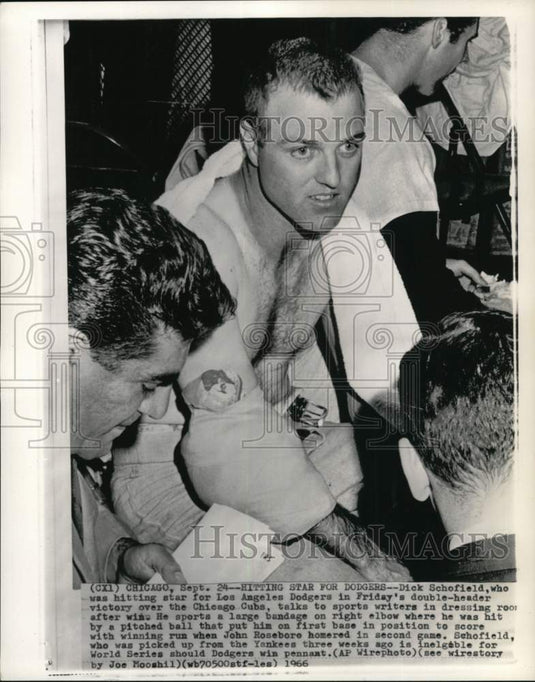1966 Press Photo Dick Schofield with bandaged elbow talks to sports writers, IL- Historic Images